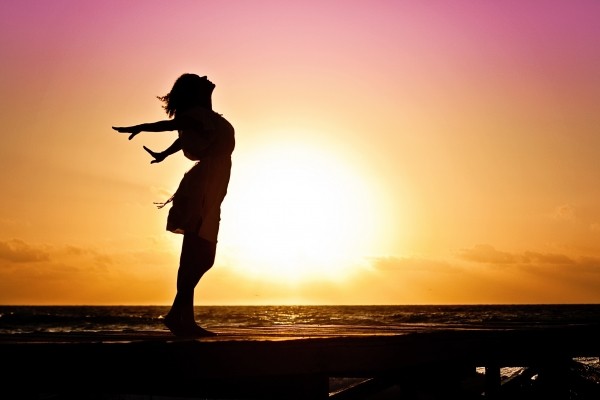 woman-happiness-sunrise-silhouette-dress-beach
